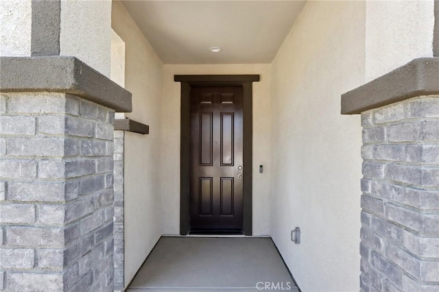 687 Ballesteros St, Perris, CA 92571 - doorway to property featuring stucco siding