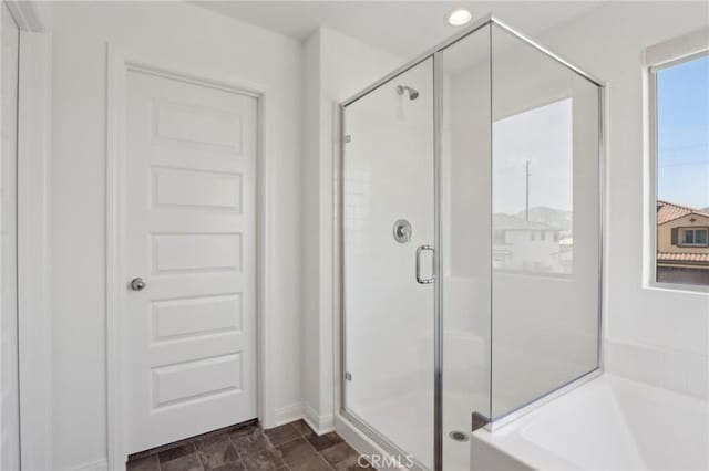687 Ballesteros St, Perris, CA 92571 - bathroom featuring a garden tub and a shower stall