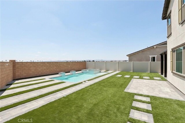 687 Ballesteros St, Perris, CA 92571 - view of yard with a fenced backyard, a patio area, and a pool with connected hot tub