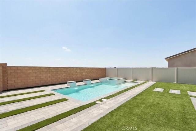 687 Ballesteros St, Perris, CA 92571 - view of swimming pool featuring a fenced backyard, a yard, a patio area, and a pool with connected hot tub