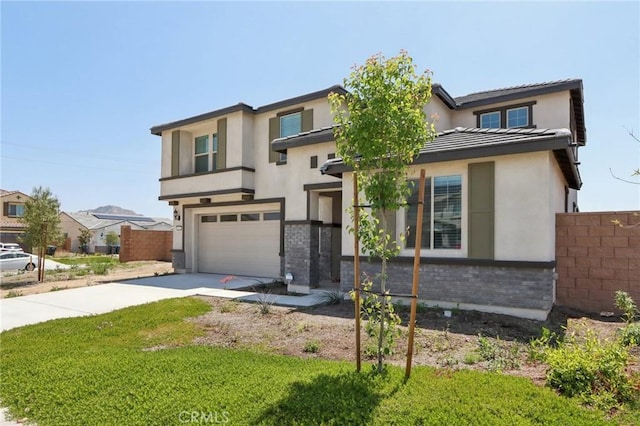 687 Ballesteros St, Perris, CA 92571 - view of front facade with a garage, fence, stucco siding, brick siding, and driveway
