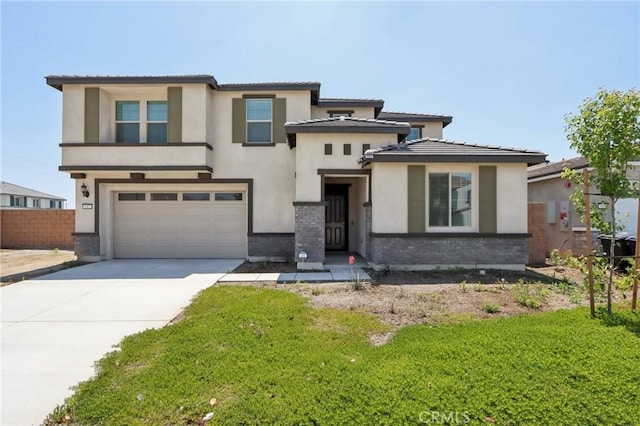 687 Ballesteros St, Perris, CA 92571 - prairie-style home featuring fence, an attached garage, a tile roof, stucco siding, and driveway