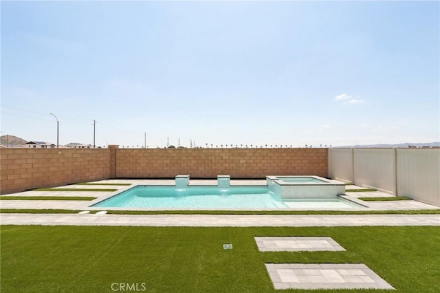687 Ballesteros St, Perris, CA 92571 - view of swimming pool with a lawn, a fenced backyard, and a pool with connected hot tub