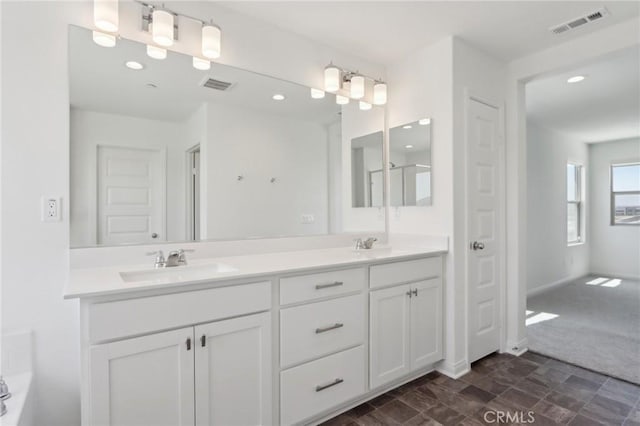 687 Ballesteros St, Perris, CA 92571 - bathroom featuring a sink, recessed lighting, double vanity, and visible vents