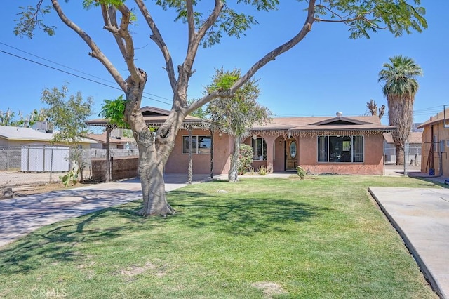 1107 B St, Brawley, CA 92227 - ranch-style home with concrete driveway, a front lawn, stucco siding, and fence
