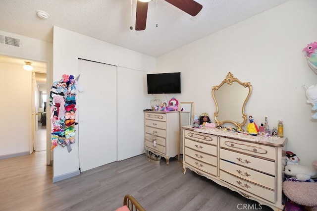 1107 B St, Brawley, CA 92227 - bedroom with a ceiling fan, a closet, light wood finished floors, and visible vents