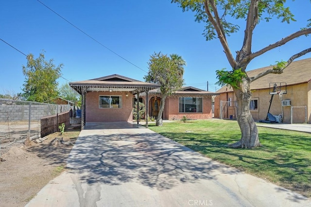 1107 B St, Brawley, CA 92227 - ranch-style house with stucco siding, a front yard, and fence