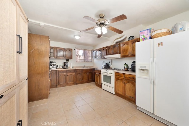 1107 B St, Brawley, CA 92227 - kitchen featuring white appliances, light countertops, under cabinet range hood, a ceiling fan, and light tile patterned floors
