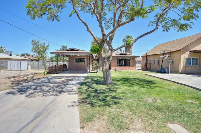 1107 B St, Brawley, CA 92227 - ranch-style house featuring fence, a front yard, stucco siding, an attached carport, and concrete driveway