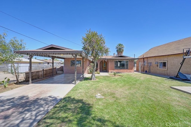 1107 B St, Brawley, CA 92227 - ranch-style home with fence, a front lawn, stucco siding, a carport, and driveway