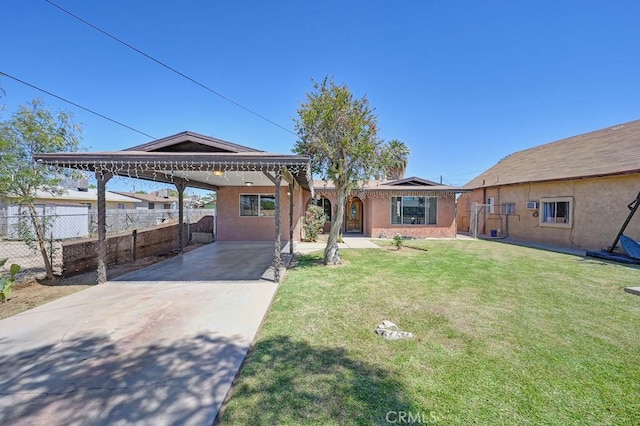 1107 B St, Brawley, CA 92227 - ranch-style home with fence, stucco siding, a front yard, concrete driveway, and a carport