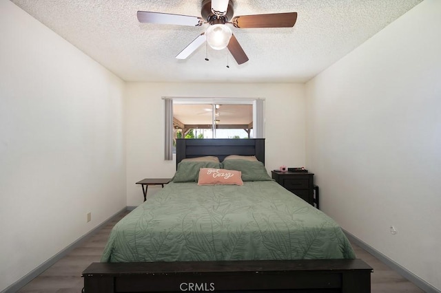 1107 B St, Brawley, CA 92227 - bedroom with baseboards, a ceiling fan, a textured ceiling, and wood finished floors