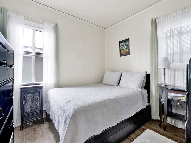 1407 Obispo Ave, Long Beach, CA 90804 - bedroom with wood finished floors and crown molding