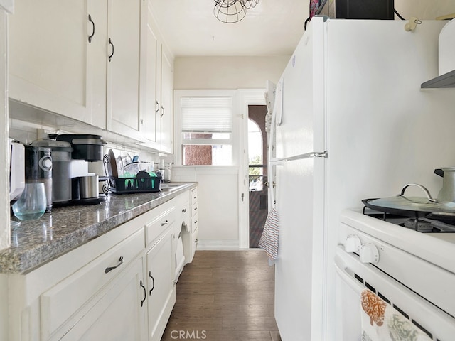 1407 Obispo Ave, Long Beach, CA 90804 - kitchen with dark wood-type flooring, white cabinetry, white gas range oven, and dark stone countertops