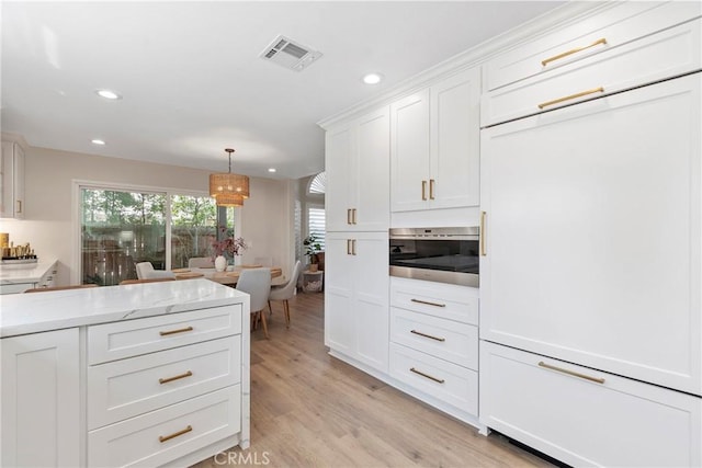 11691 Mount Baker Ct, Rancho Cucamonga, CA 91737 - kitchen with paneled fridge, a chandelier, recessed lighting, white cabinets, and light wood finished floors