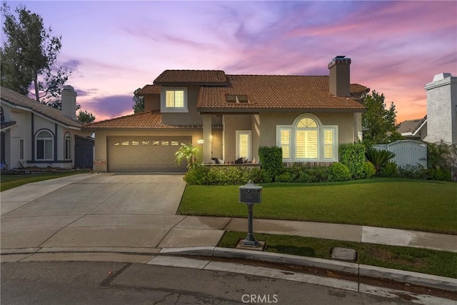 11691 Mount Baker Ct, Rancho Cucamonga, CA 91737 - mediterranean / spanish house with a tiled roof, a yard, concrete driveway, stucco siding, and a garage