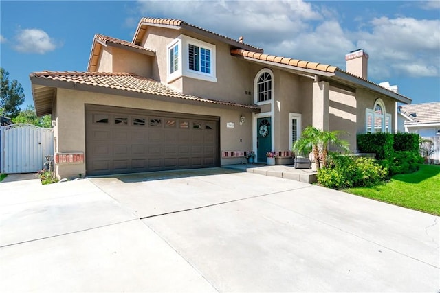 11691 Mount Baker Ct, Rancho Cucamonga, CA 91737 - mediterranean / spanish home featuring a gate, a chimney, driveway, and stucco siding