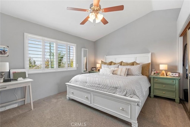 bedroom with vaulted ceiling, carpet, and ceiling fan