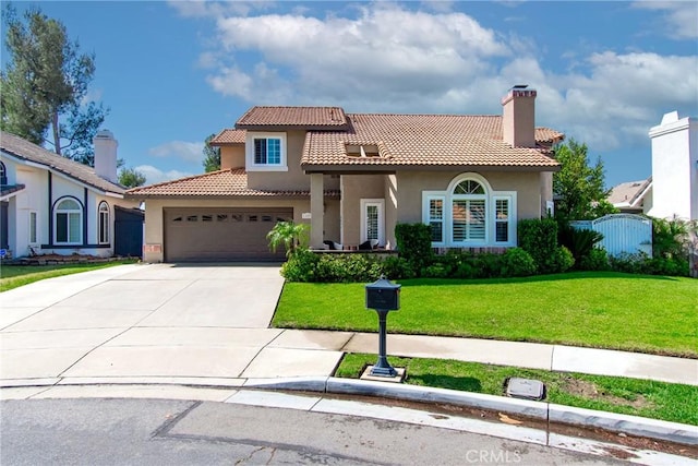 mediterranean / spanish-style house with stucco siding, concrete driveway, a front yard, a tiled roof, and an attached garage