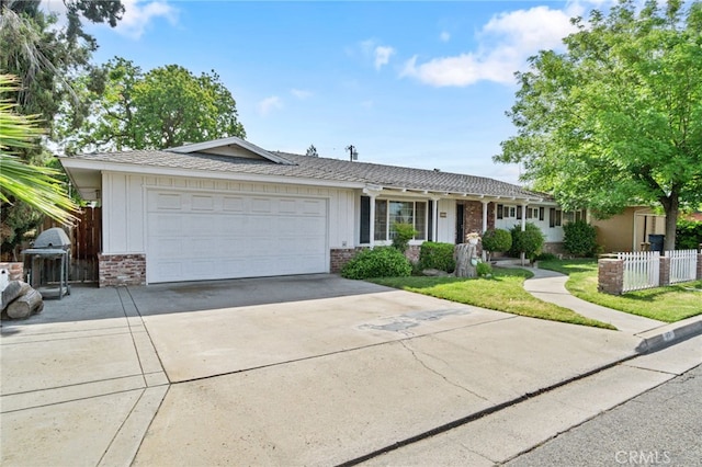 117 Spring Way, Madera, CA 93637 - single story home with concrete driveway, brick siding, an attached garage, and fence