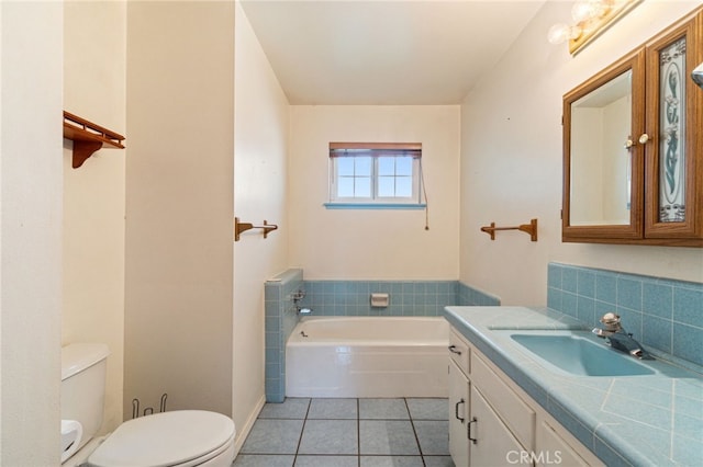 117 Spring Way, Madera, CA 93637 - bathroom with toilet, tile patterned floors, a bath, and vanity