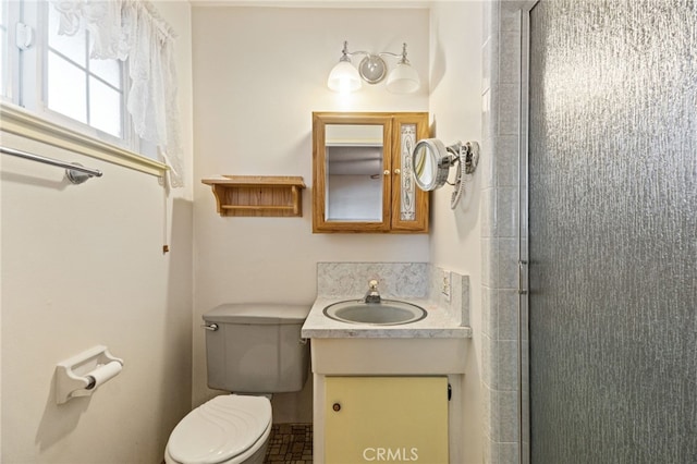 117 Spring Way, Madera, CA 93637 - bathroom featuring vanity, a shower with shower door, and toilet