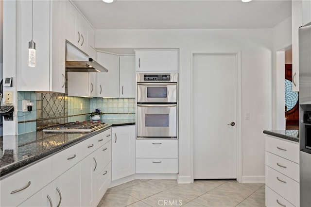 12320 Louise Ave, Granada Hills, CA 91344 - kitchen featuring stainless steel appliances, under cabinet range hood, decorative backsplash, dark stone countertops, and white cabinets