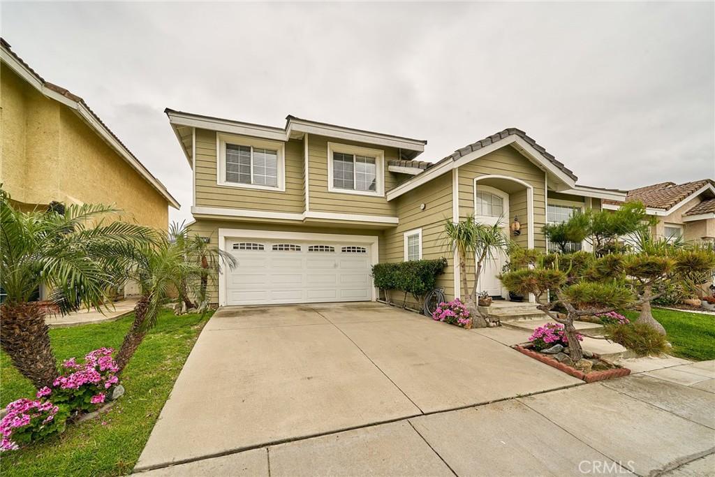 7400 Oxford Ave, Buena Park, CA 90621 - view of front of property with a garage and driveway
