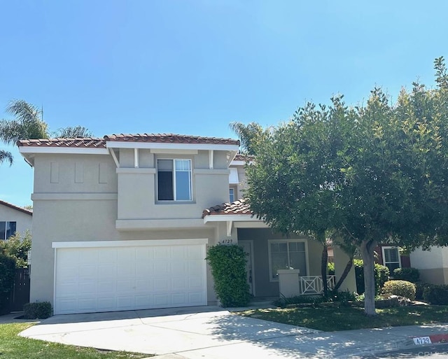 4729 Lagunita Way, Oceanside, CA 92057 - mediterranean / spanish-style home with a tile roof, stucco siding, driveway, and a garage