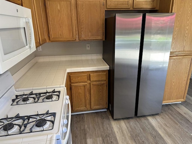4729 Lagunita Way, Oceanside, CA 92057 - kitchen featuring white appliances, tile countertops, and wood finished floors