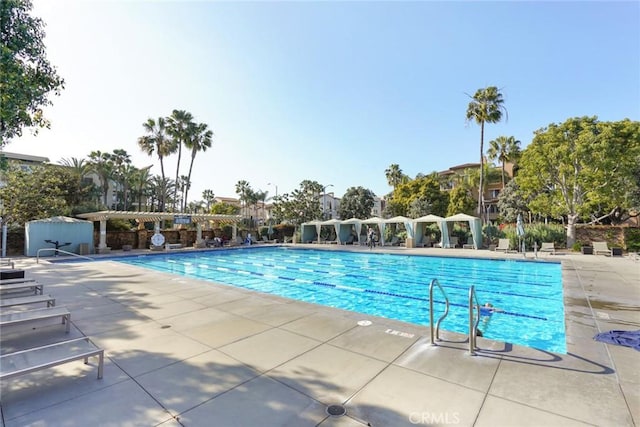 community pool with a patio area