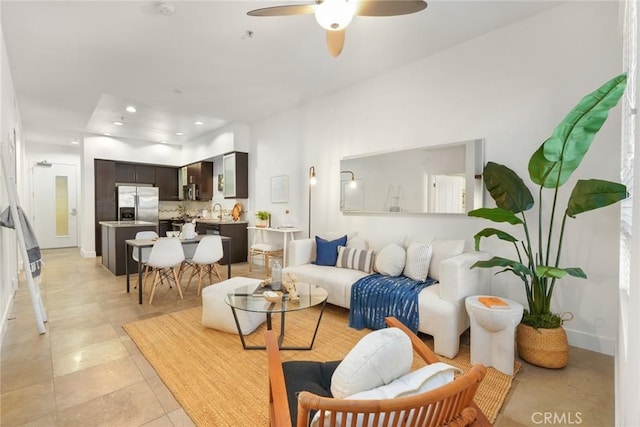 living area with recessed lighting, a ceiling fan, and light tile patterned floors