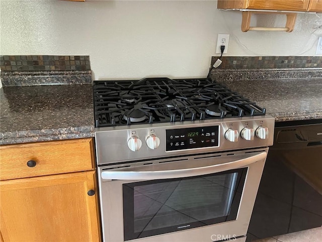 details featuring dark countertops, brown cabinets, and gas range