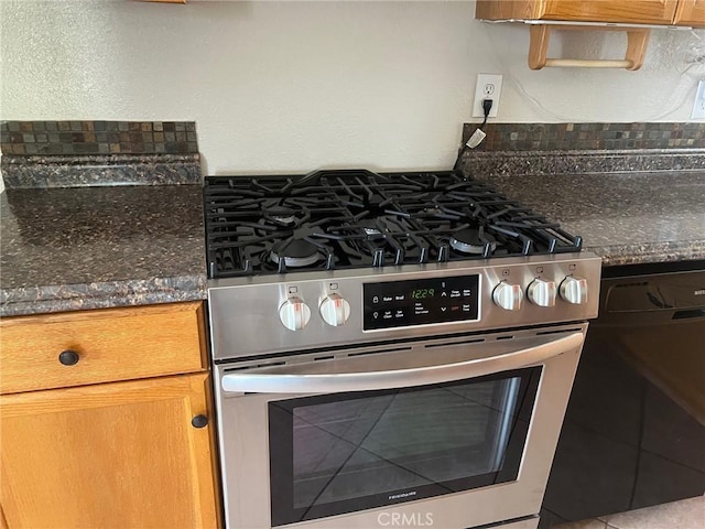 6614 Mojave Ave Unit 29, Palms, CA 92277 - kitchen with stainless steel gas stove, dark countertops, and brown cabinetry