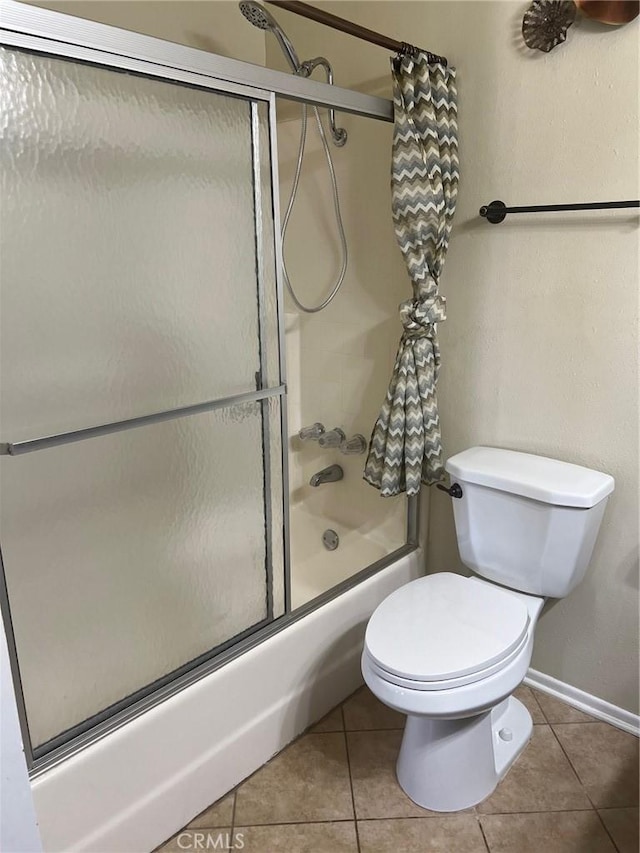 6614 Mojave Ave Unit 29, Palms, CA 92277 - bathroom featuring shower / bath combination with glass door and tile patterned flooring