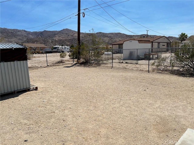 6614 Mojave Ave Unit 29, Palms, CA 92277 - view of yard featuring a mountain view and an outbuilding