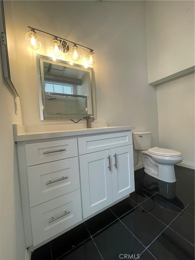 420 S San Pedro St Unit 102, Los Angeles, CA 90013 - bathroom with tile patterned flooring, toilet, vanity, and baseboards