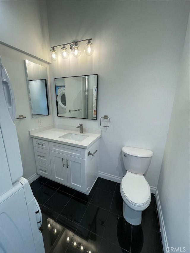 420 S San Pedro St Unit 102, Los Angeles, CA 90013 - bathroom featuring baseboards, tile patterned flooring, vanity, and toilet