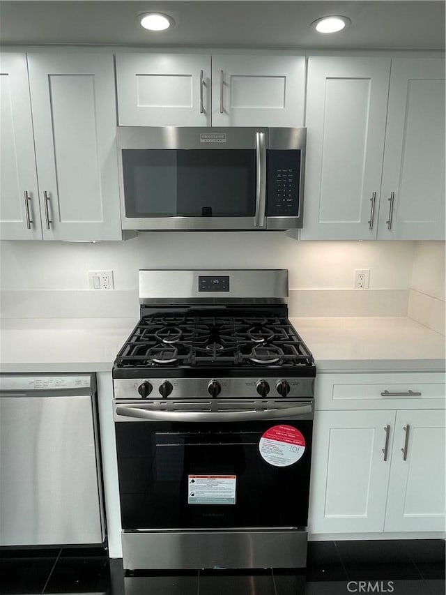 420 S San Pedro St Unit 102, Los Angeles, CA 90013 - kitchen with stainless steel appliances, light countertops, white cabinetry, and recessed lighting