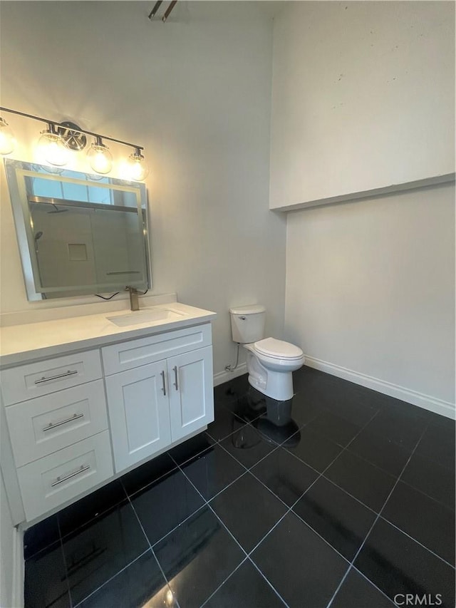 420 S San Pedro St Unit 102, Los Angeles, CA 90013 - bathroom with vanity, tile patterned flooring, baseboards, and toilet