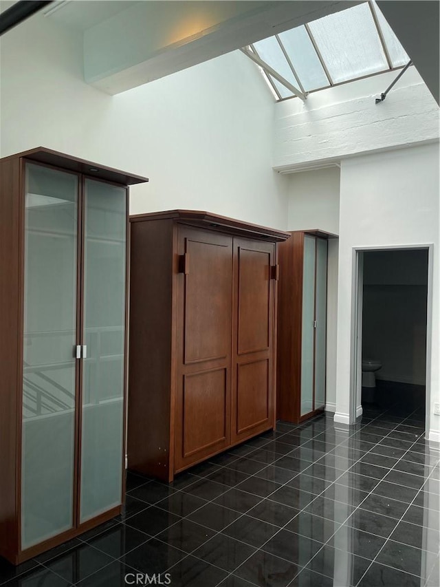 420 S San Pedro St Unit 102, Los Angeles, CA 90013 - additional living space featuring a skylight and dark tile patterned flooring