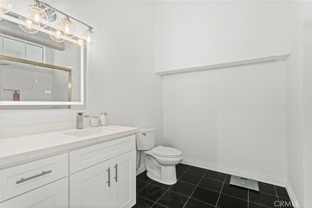 420 S San Pedro St Unit 102, Los Angeles, CA 90013 - full bath featuring tile patterned floors, vanity, and a shower with door