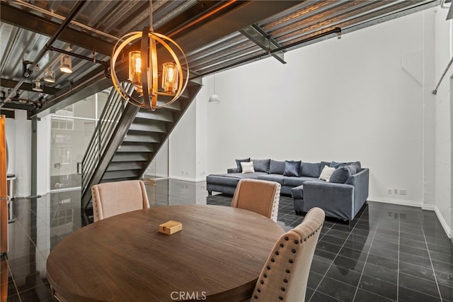 420 S San Pedro St Unit 102, Los Angeles, CA 90013 - dining room featuring stairs and a chandelier