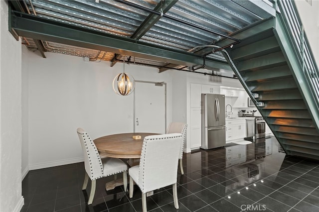 420 S San Pedro St Unit 102, Los Angeles, CA 90013 - dining room with a chandelier and dark tile patterned flooring