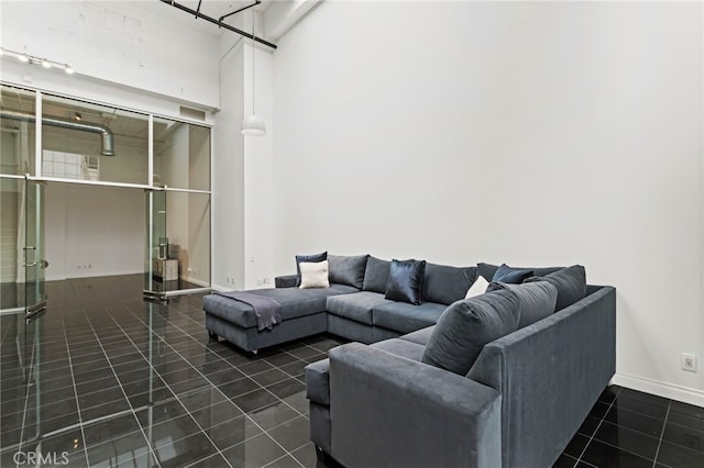 420 S San Pedro St Unit 102, Los Angeles, CA 90013 - living area with dark tile patterned floors and baseboards