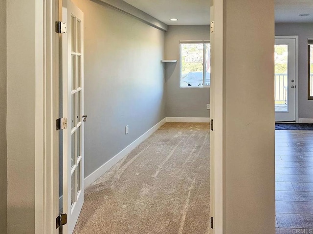 hall with recessed lighting, baseboards, french doors, and carpet flooring
