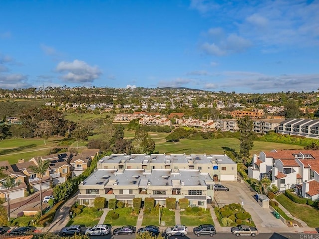 birds eye view of property featuring golf course view and a residential view