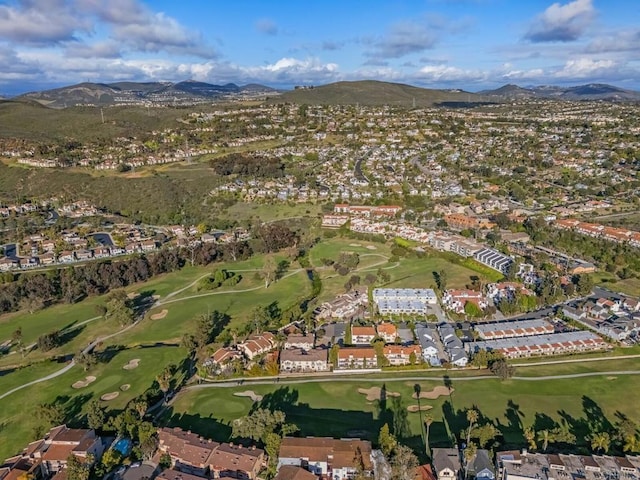 aerial view with view of golf course, a residential view, and a mountain view