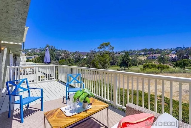 view of wooden balcony with a deck