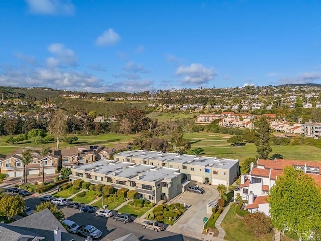 drone / aerial view featuring a residential view and view of golf course